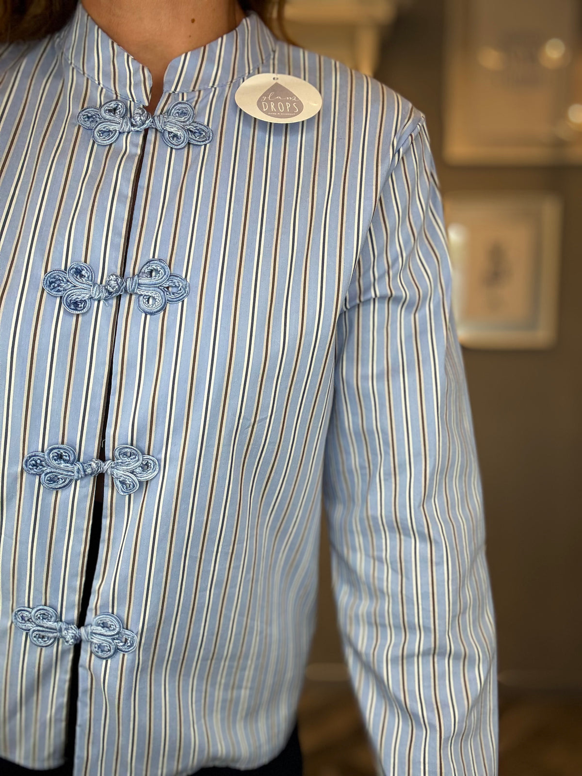 Camicia alamari celeste a righe