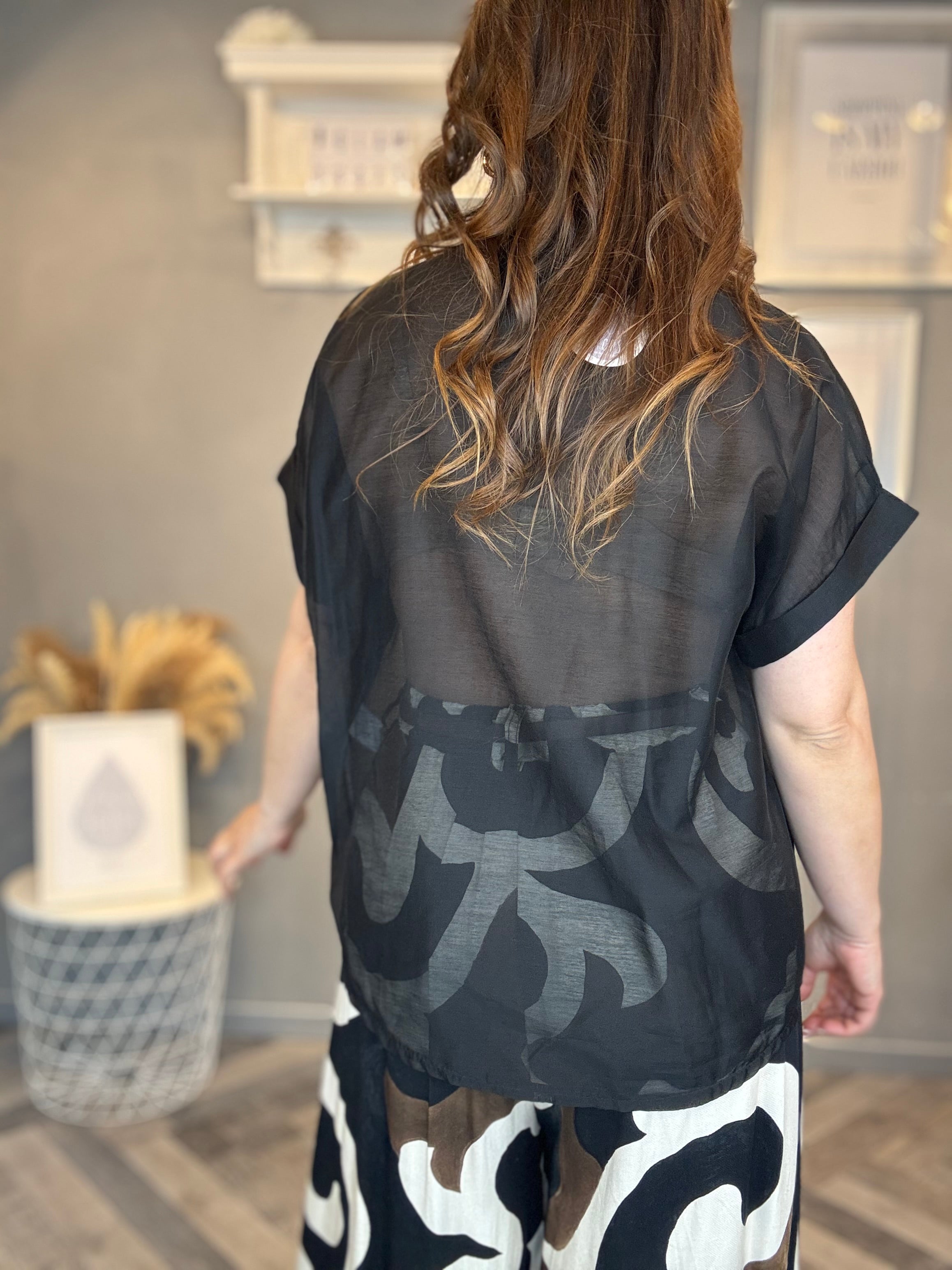Camicia nera con tasca paillettes