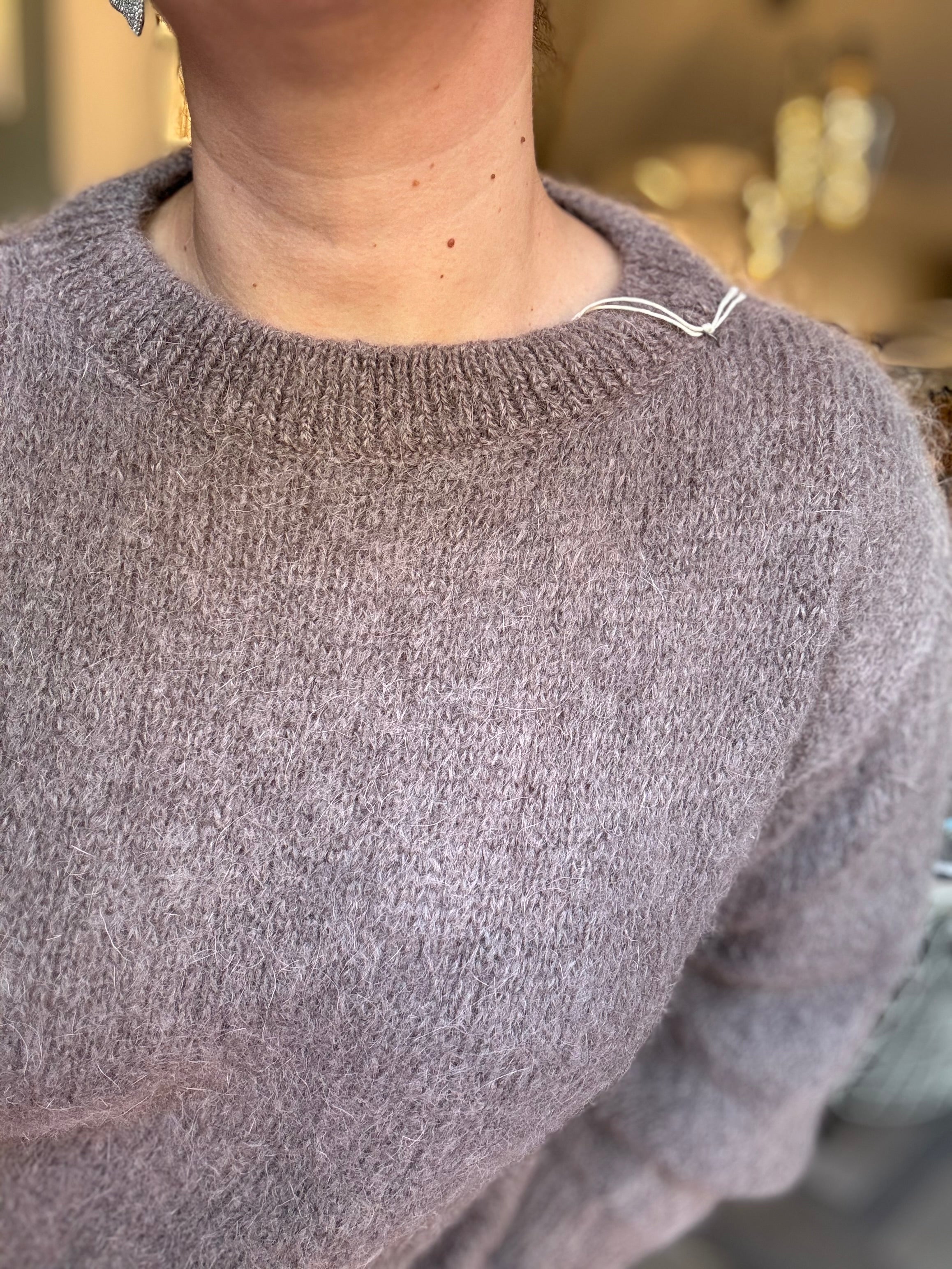 Maglione in mohair con fiocco decorativo sul retro