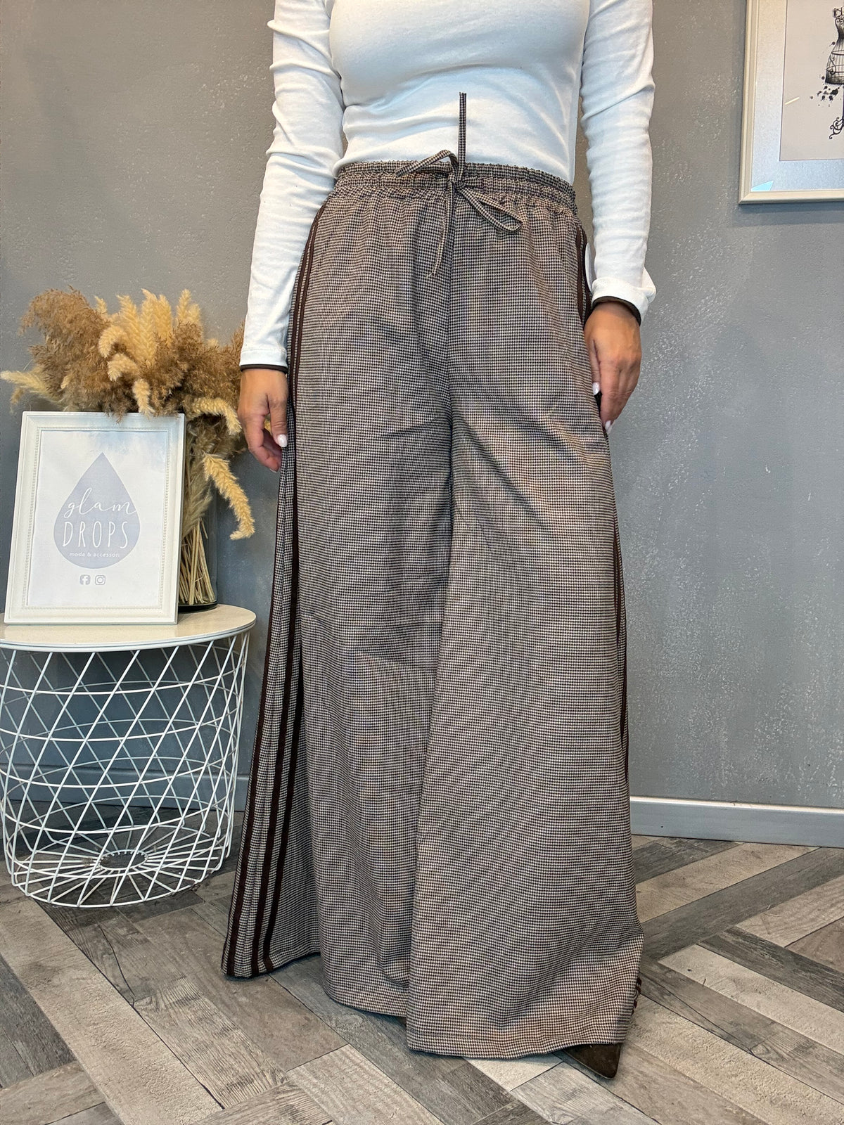 Pantalone palazzo check con bande laterali